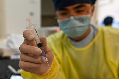 Challenging last mile for China's vaccine push after zero-Covid retreat