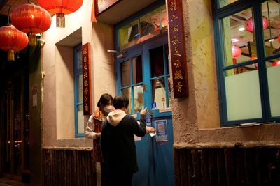 Chinese businesses guard against wave of infections feared after COVID easing