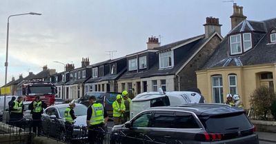 Car flips on its side after horror Falkirk crash as police close off road