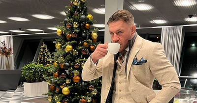 Conor McGregor all smiles as he models new line of 'oatmeal' suits