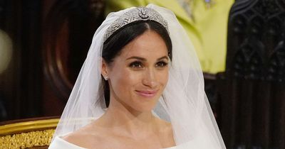 Who walked Meghan Markle down the aisle at her wedding to Prince Harry?