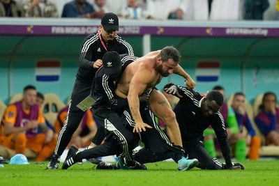 Fan runs on field during Argentina-Netherlands at World Cup