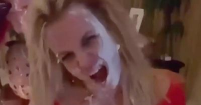 Britney Spears concerns fans by smothering herself in cake in bizarre Instagram return