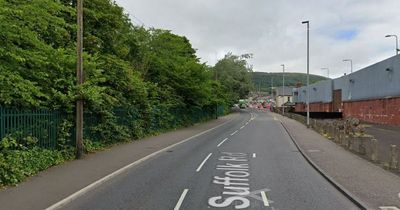 Suffolk Road Belfast: Man in serious condition after being 'struck by car'