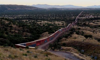 Arizona governor builds border wall of shipping crates in final days of office