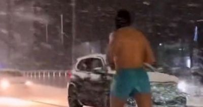 People astonished by 'brave' man running in snow wearing just shorts and a balaclava