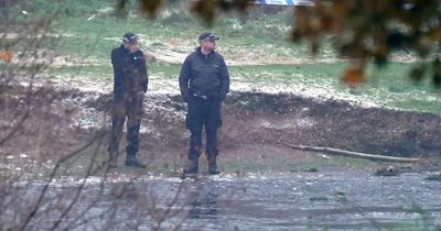 Police officer tried to punch through ice as others waded into freezing lake to save tragic children