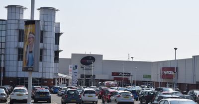 Boy, 14, arrested after four people injured at retail park