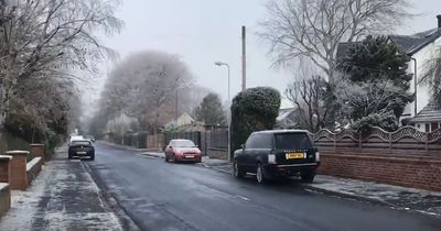 Neighbours wake up to rare snowfall in seaside town