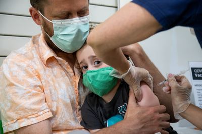 Most U.S. kids still lack a flu or COVID vaccine. It's helping fuel a tripledemic that's slamming hospitals nationwide