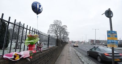 Balloon and flowers left for 'superhero' boy, 13, killed in crash