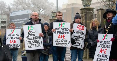 'Please Santa, more doctors, more nurses, more beds': Signs held at protest demand more resources at Our Lady of Lourdes Hospital in Drogheda