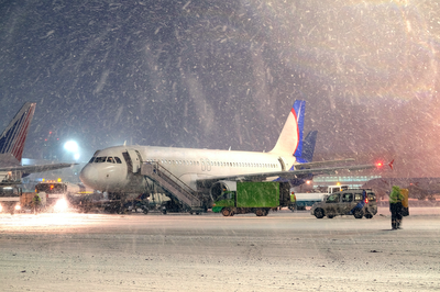 ‘Disgraceful’: Kids sleep on airport floor as flights delayed by snow
