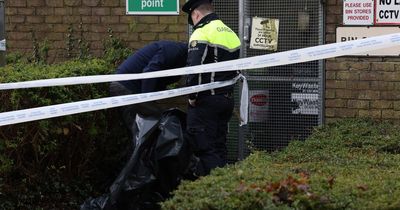 Gardai seize suspected murder weapon as west Dublin apartment is sealed off after body find in field