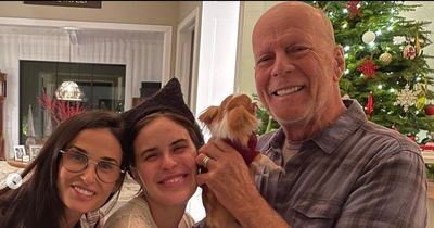 Bruce Willis cuddles puppy in first family photos since quitting acting over health