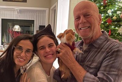 Bruce Willis cuddles dog in first family photos since retirement due to health