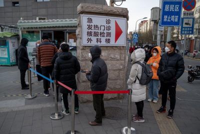 Covid surge spooks Beijing residents, disrupts government