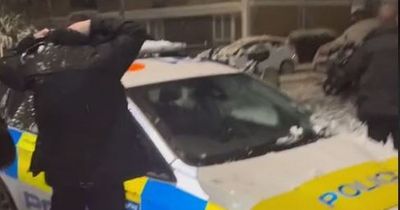 Police filmed in SNOWBALL FIGHT with residents praised for 'positive policing'