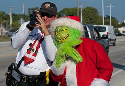 Deputy dressed as Grinch gives onions to speeding drivers