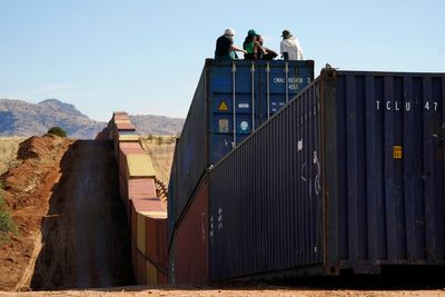 US government sues Arizona governor for using shipping containers as barrier on Mexico border