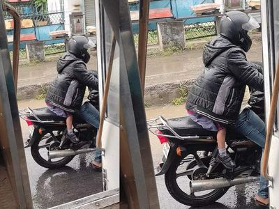 This VIRAL photo of father protecting his kid from rain will make you appreciate your dad right away
