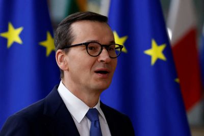 Poland holds up EU deal on minimum corporate tax, aid for Ukraine
