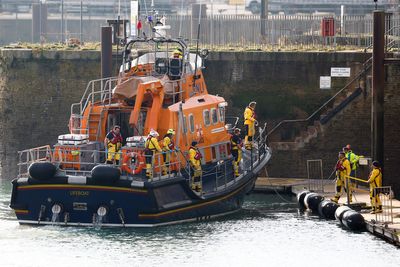 With ropes and hands, trawler crew save dozens of migrants from freezing waters after dinghy sinks