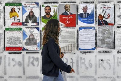 Tunisia awaits languid election for powerless parliament