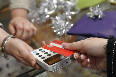 Retail spending dips as holiday sales bite into inflation