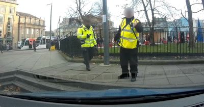 Moment Edinburgh traffic warden caught on camera swearing at driver in parking row