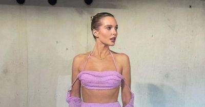 Helen Flanagan divides fans as she braves plummeting temperatures to show off abs in barely there outfit