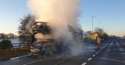 Mercedes melts onto M6 carriageway as car transporter bursts into flames