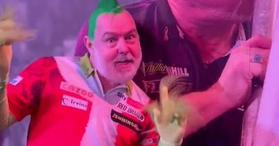 Peter Wright reprises Grinch outfit as he begins World Darts Championship defence