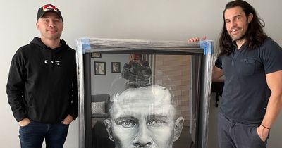 Bangor artist stunned as Carl Frampton stops by to pick up 'epic' portrait