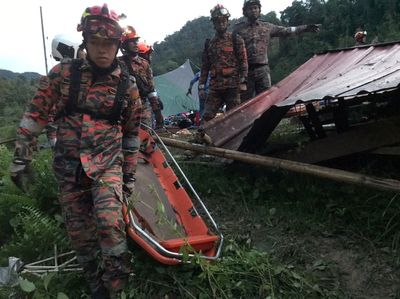Malaysia campsite landslide kills 21, including children