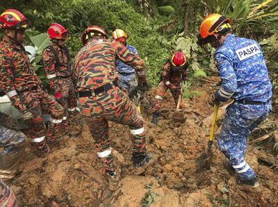 At least 19 dead after landslide tears through Malaysian campsite