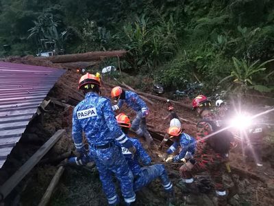 2 dead, 51 missing as landslide hits Malaysian campsite