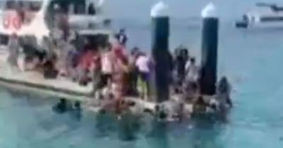 Dozens of travellers topple into the ocean after major bridge collapses in Bali