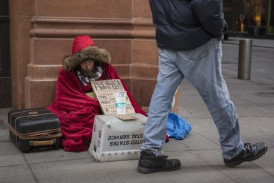 What can I do to help homeless people in freezing conditions?