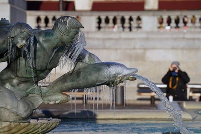 Trafalgar Square fountain freezes as London’s big chill continues