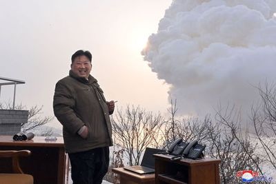 Kim Jong-Un enjoys a cigarette in ‘outdoor office’ on snowy mountain during missile test