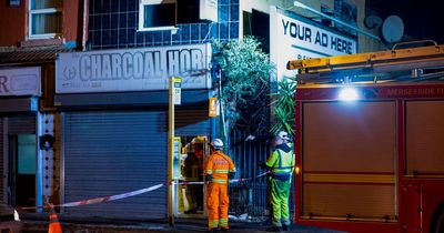 Fire service seal off takeaway after building collapse and fire