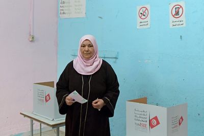 Tunisians vote for toothless parliament in poll shunned by opposition
