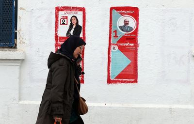 Tunisians trickle in to vote in elections as opposition boycotts