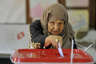 Tunisians shun vote for powerless new parliament