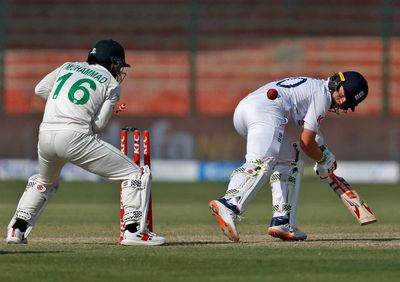 Ollie Pope hits half-century as Pakistan spinners keep England in check