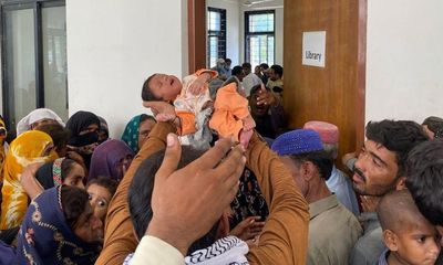 A newborn held aloft in Pakistan sums up the sheer injustice of the climate crisis