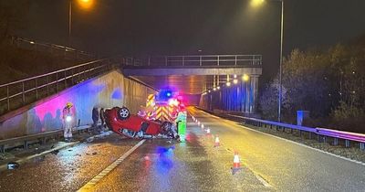 Four people escape unhurt after motorway crash ends with car on its roof