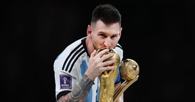 Who surprised Lionel Messi on the pitch before lifting 2022 World Cup trophy for Argentina