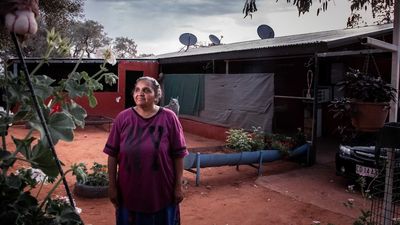 Residents of 73 remote communities launch class action against NT government alleging poor conditions, racism